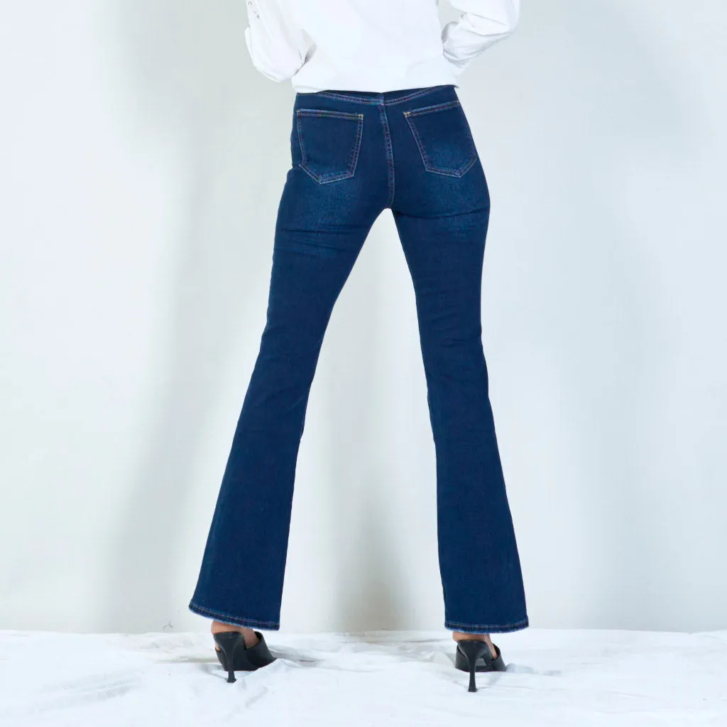 Modern high-waisted flared jeans with raw hem wholesale