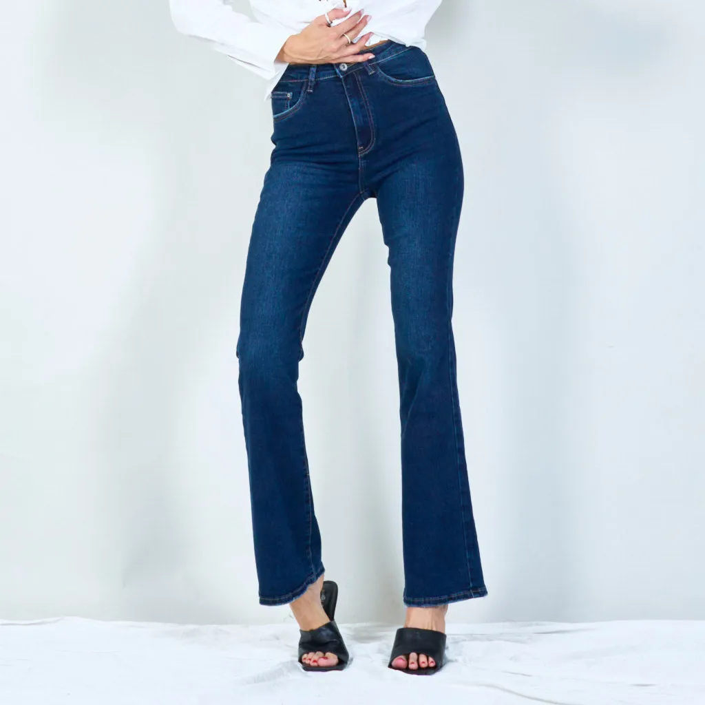 Modern high-waisted flared jeans with raw hem wholesale