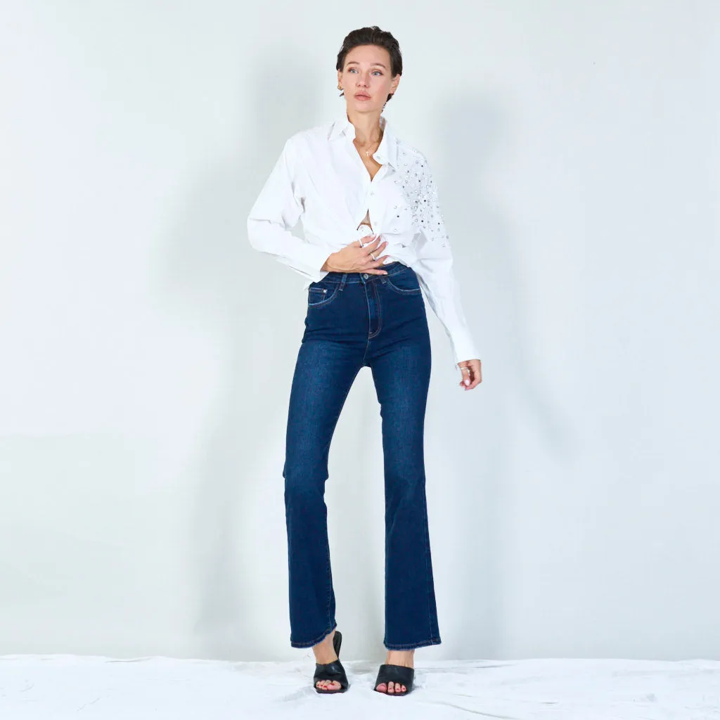 Modern high-waisted flared jeans with raw hem wholesale