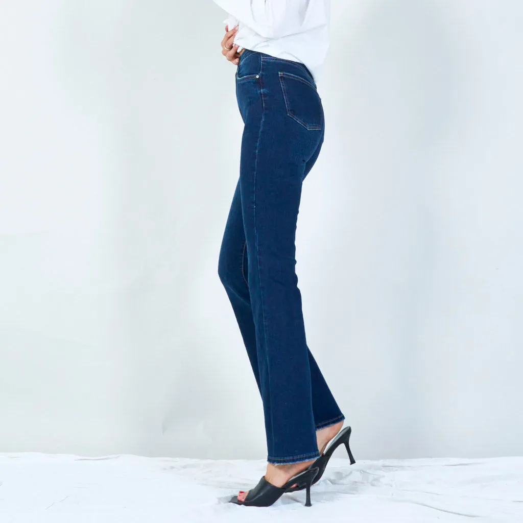 Modern high-waisted flared jeans with raw hem wholesale