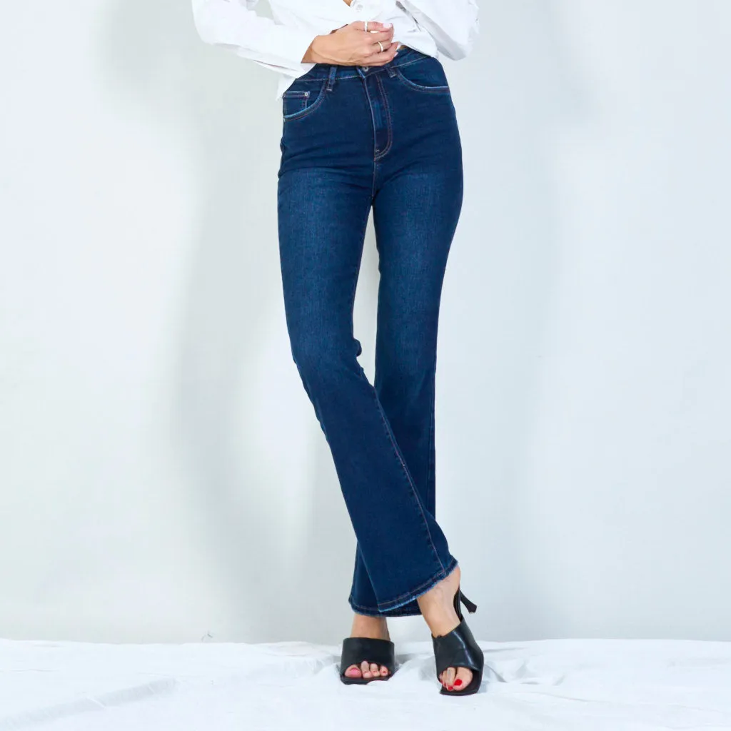 Modern high-waisted flared jeans with raw hem wholesale