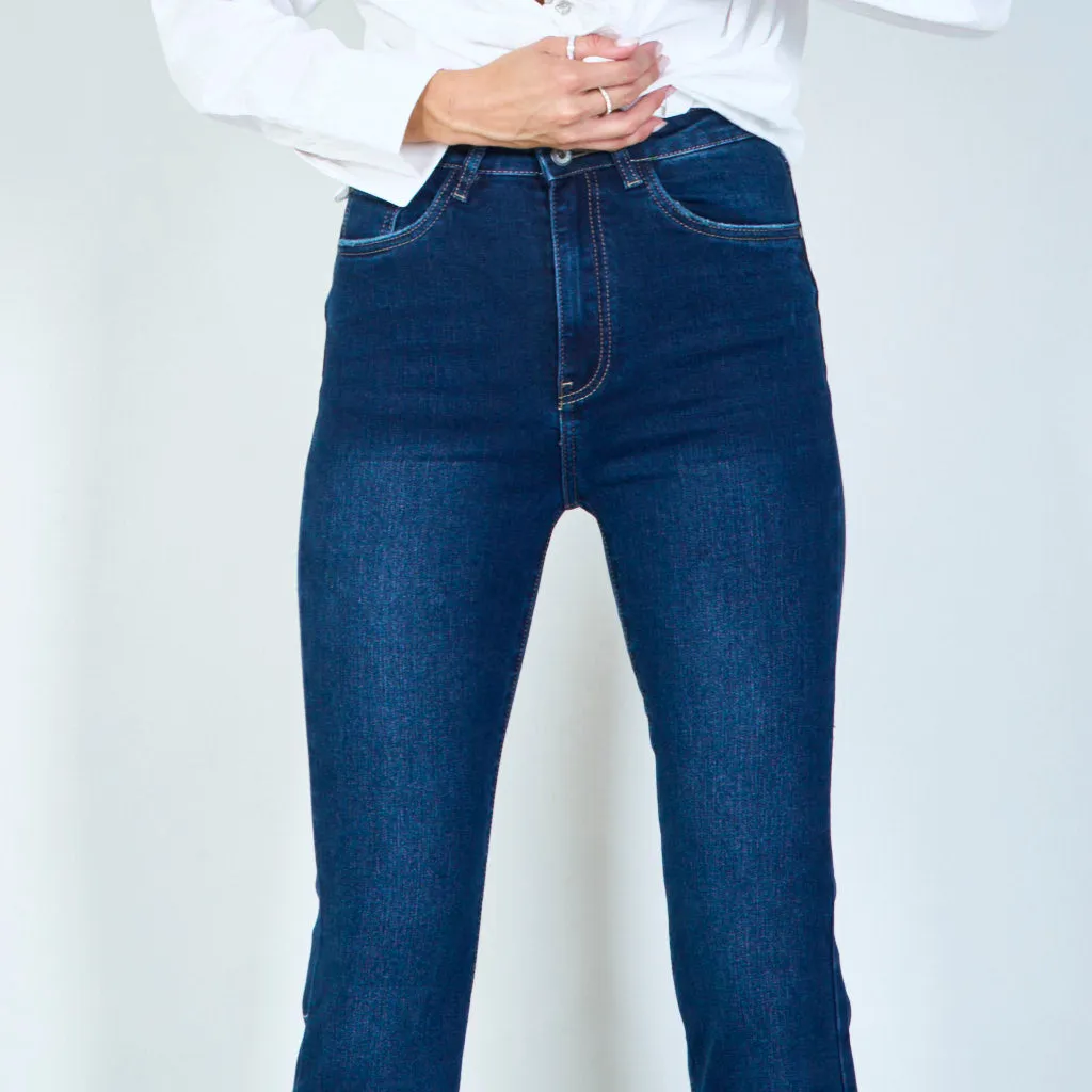 Modern high-waisted flared jeans with raw hem wholesale