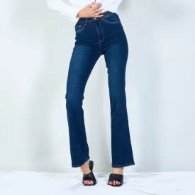 Modern high-waisted flared jeans with raw hem wholesale